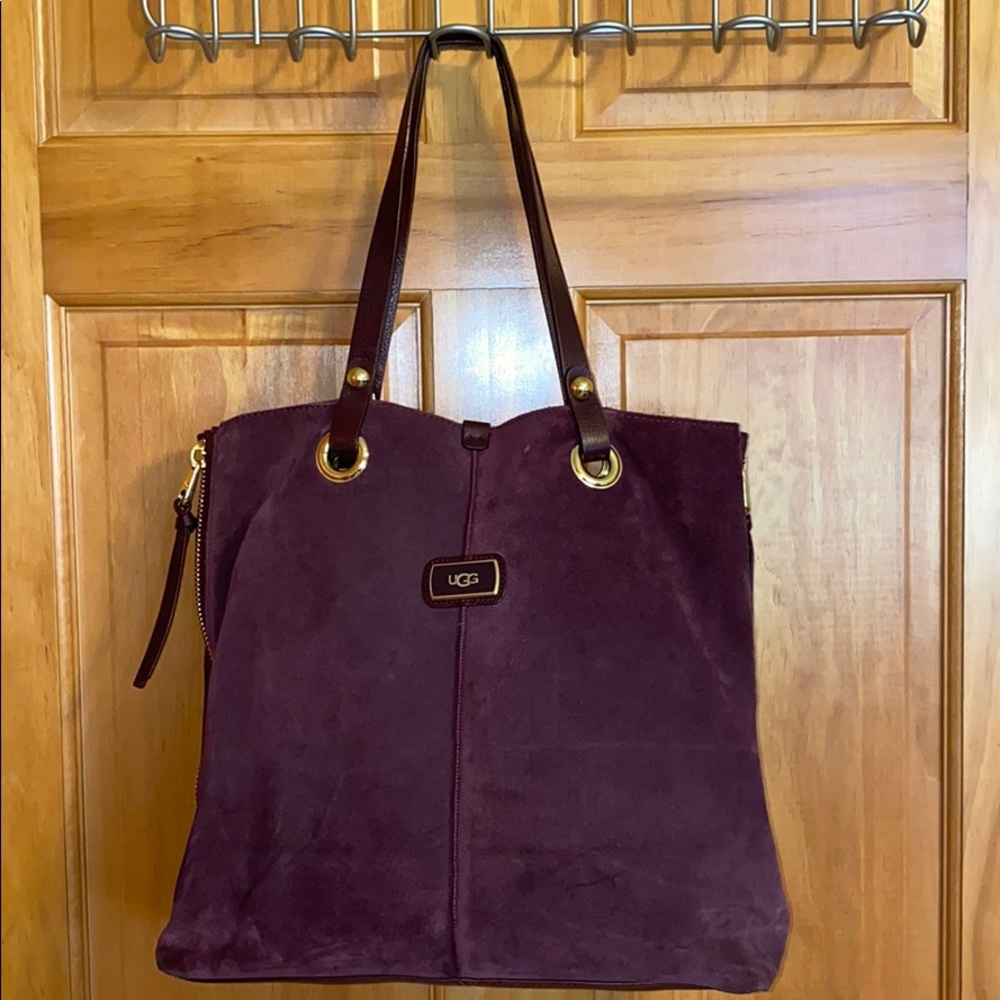 Ugg purse plum with gold details.